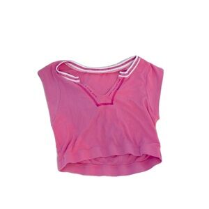 Pink low cut cropped shirt.